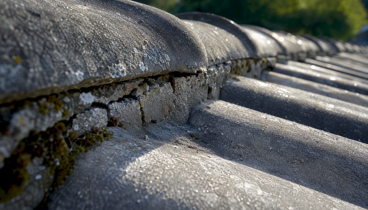 Close-up of cracked tile roof mortar