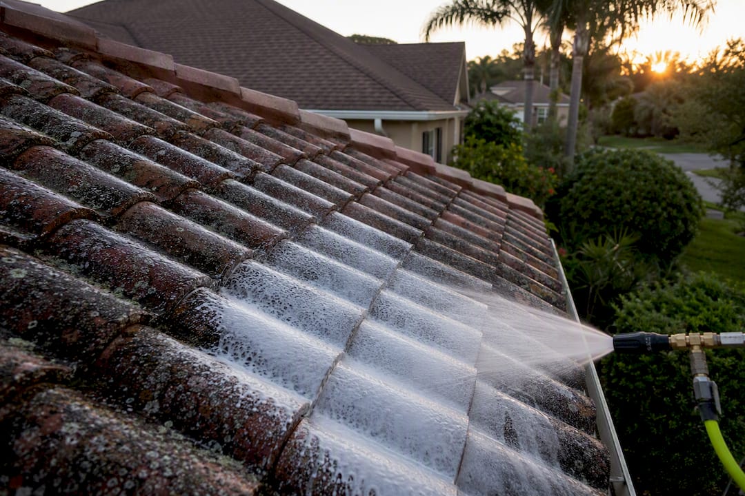 Soft wash foam on tile roof surface