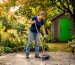 Homeowner sweeping stone patio outdoors