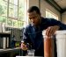 Technician inspecting water filtration system components