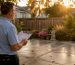 Landlord inspecting clean rental property exterior
