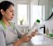 Homeowner reading cleaning product label in kitchen