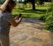 Homeowner photographing porch surface closely