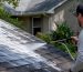 Soft wash foam being applied to roof shingles