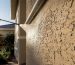 Damaged stucco receiving gentle low-pressure rinse